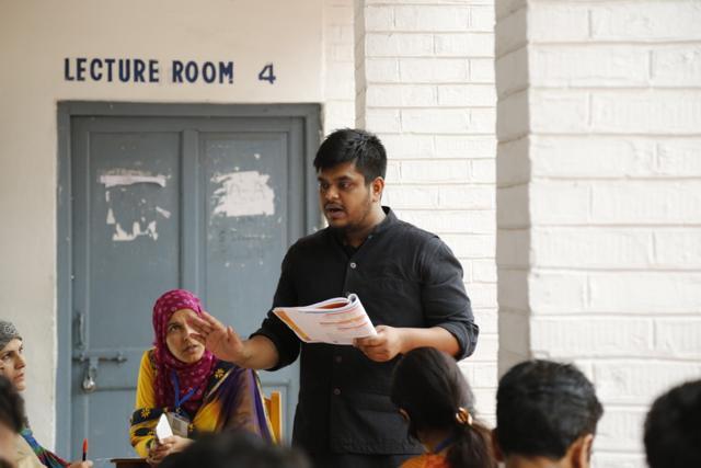 A professor delivering lecture.