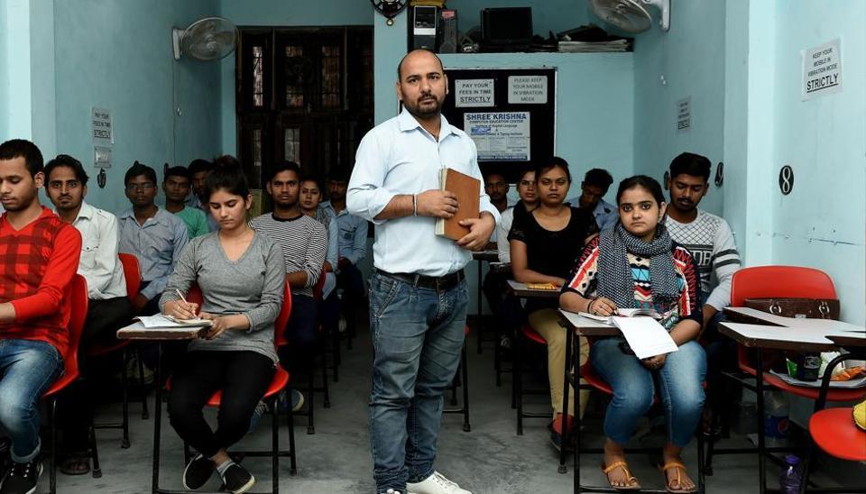 A teacher in classroom with his students