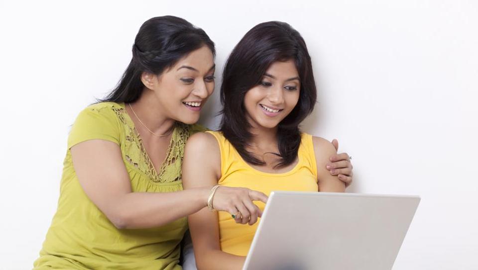 Mother helping her daughter