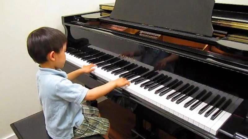 Kid playing piano