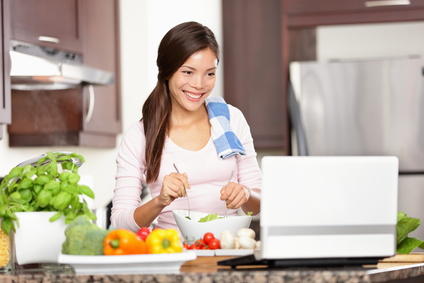A woman learning cooking online
