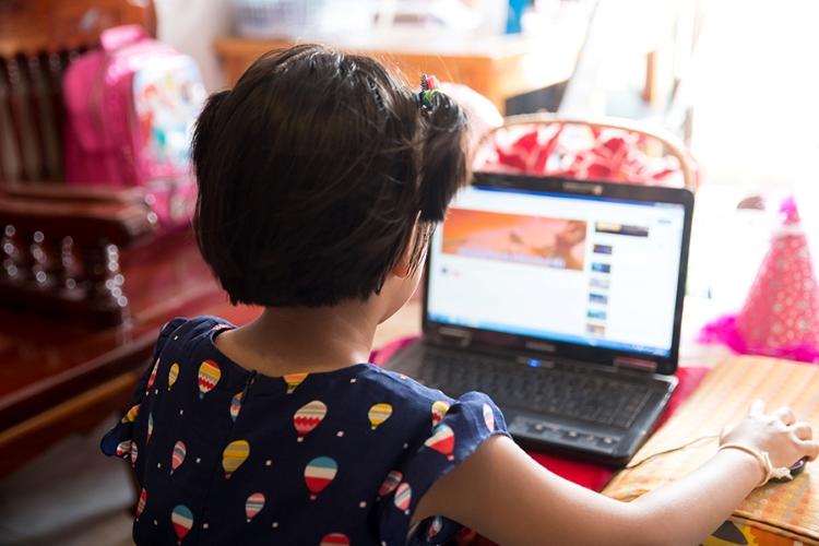 A child with a laptop