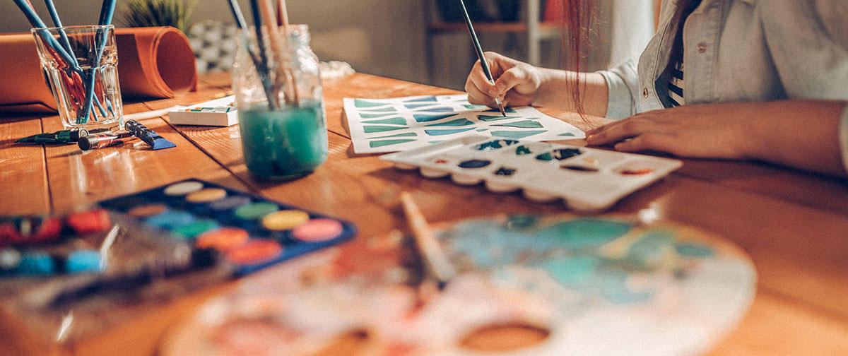 Student practices painting