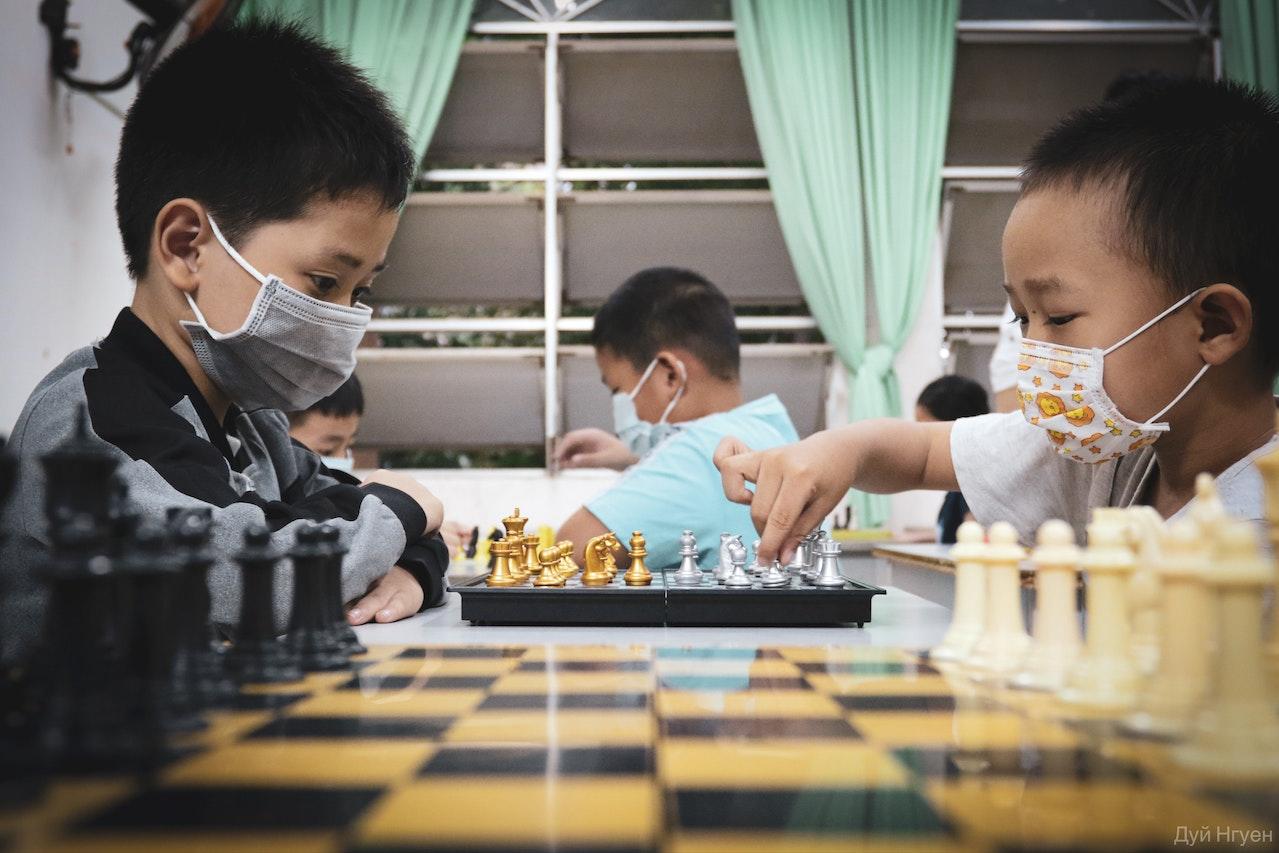 Children learning chess