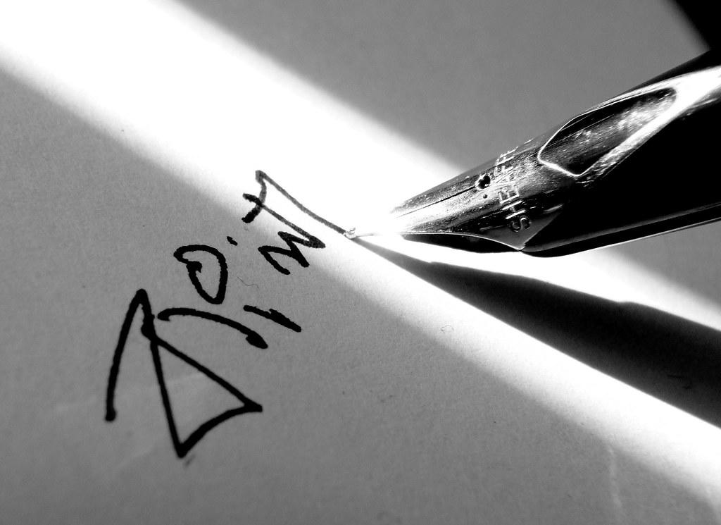 pen writing in Bengali script