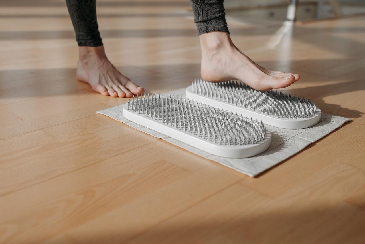 Acupressure foot mat with nails.