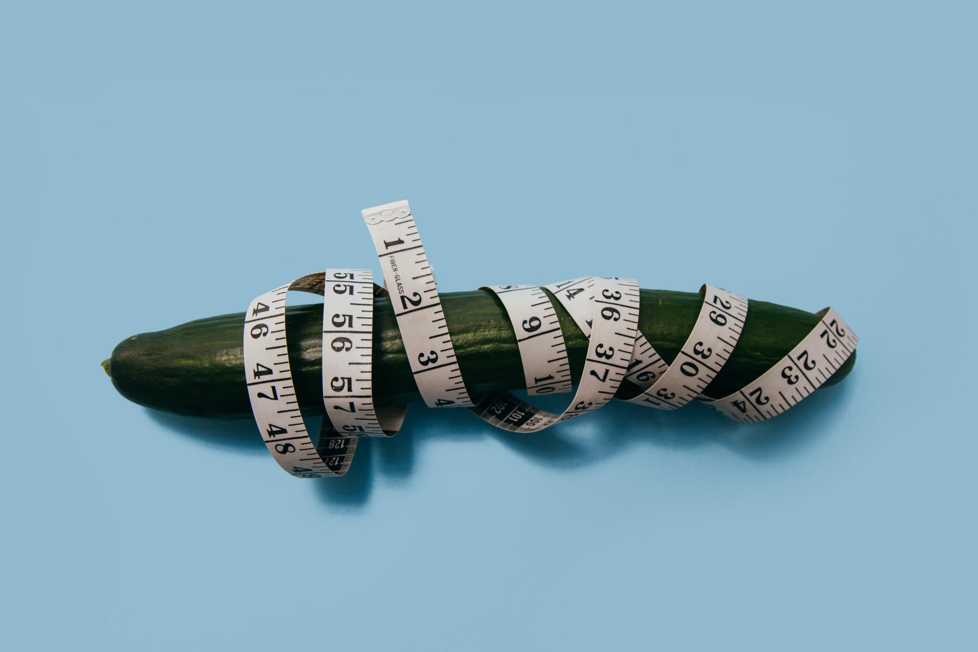 cucumber with a measuring tape around it