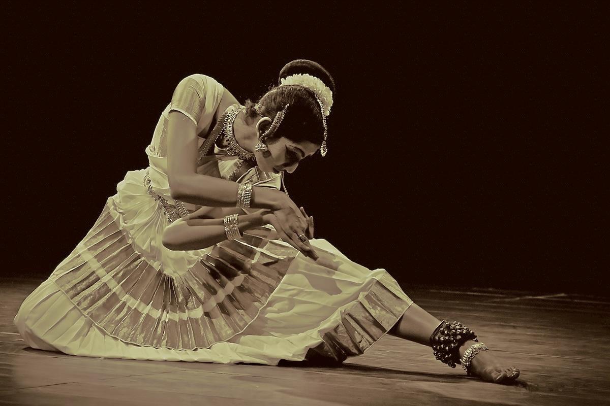solo dancer in white traditional Indian costume