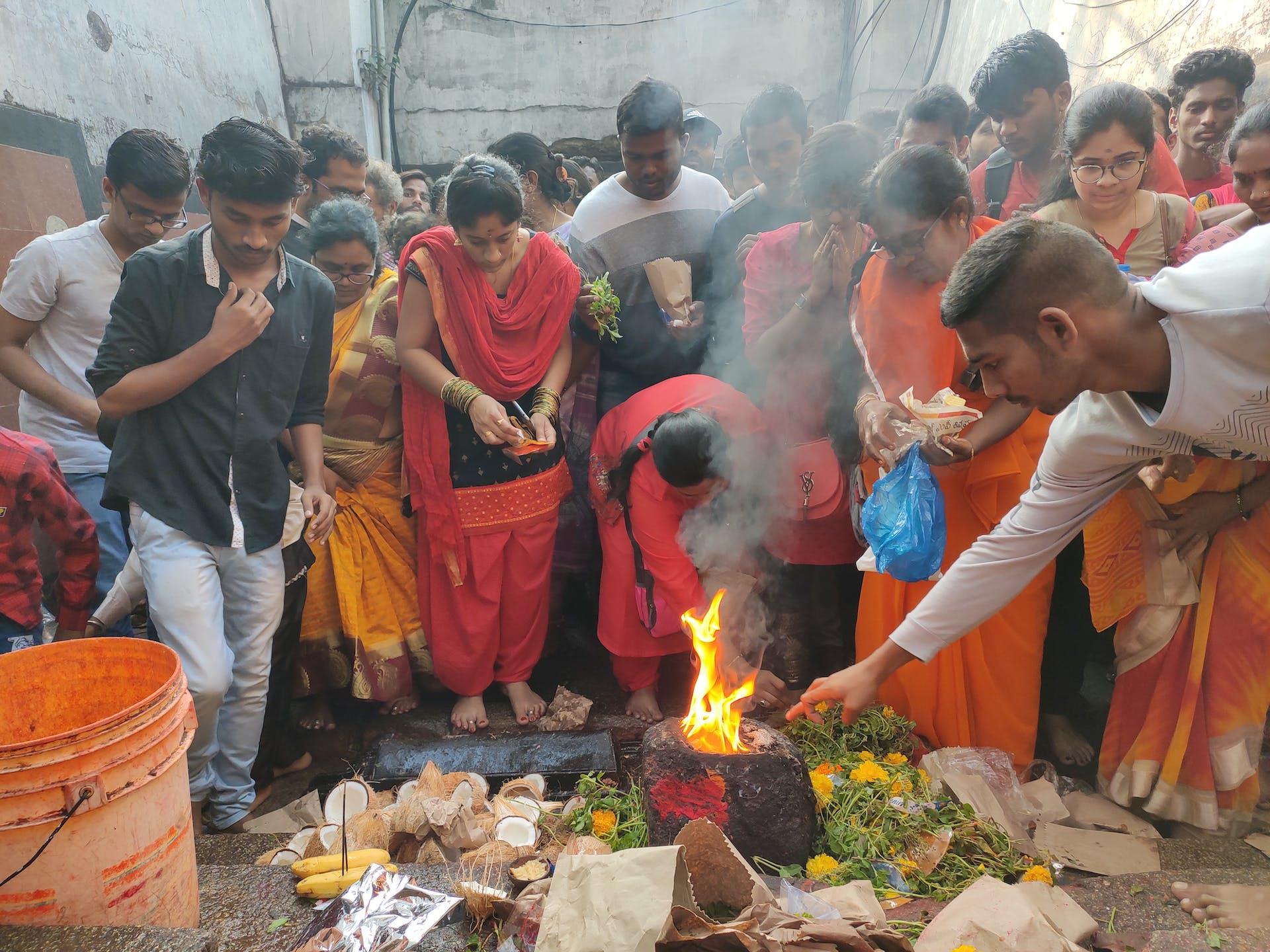 People participating in a ritual yajna fire ceremony