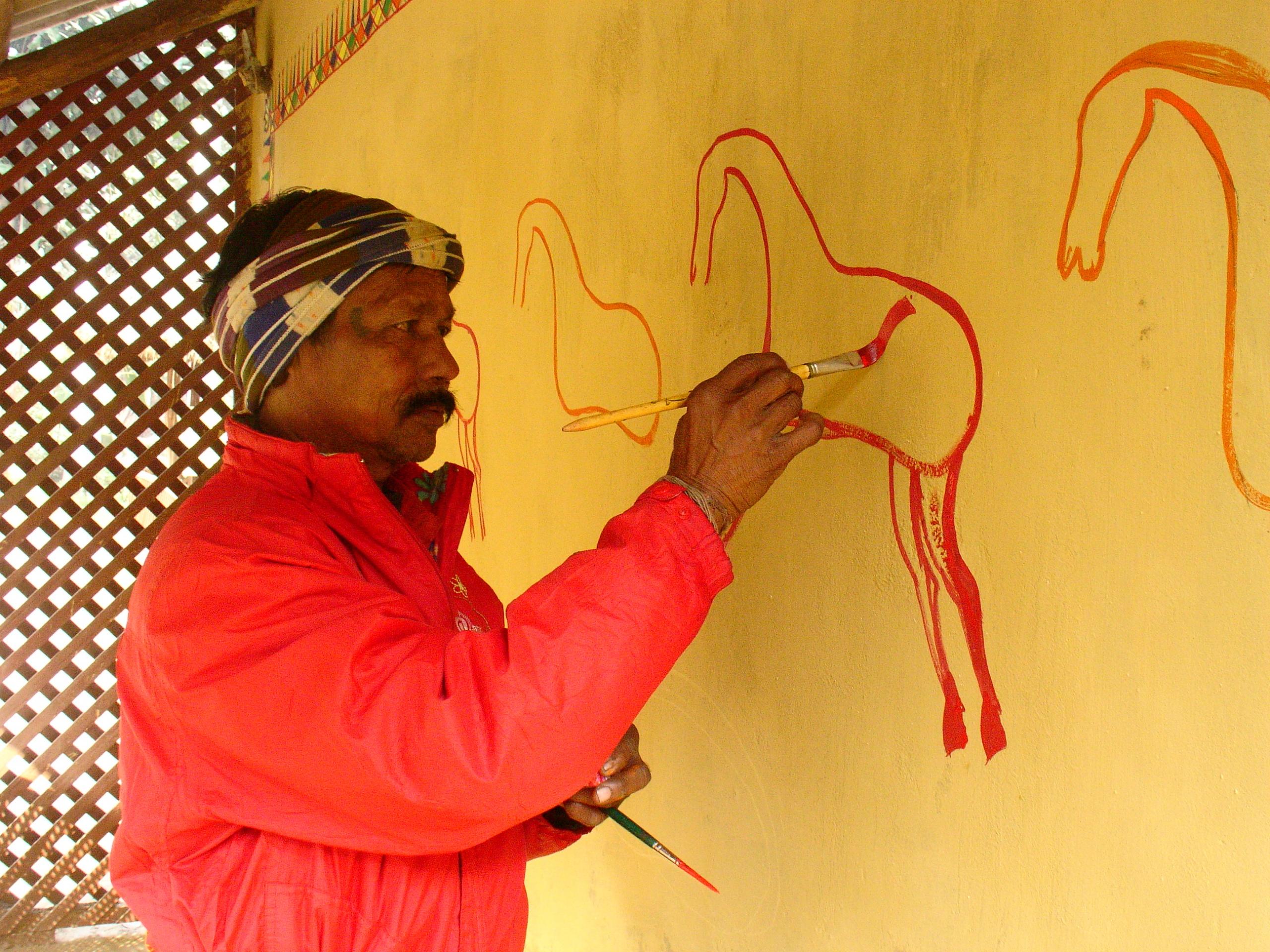 artist painting on wall