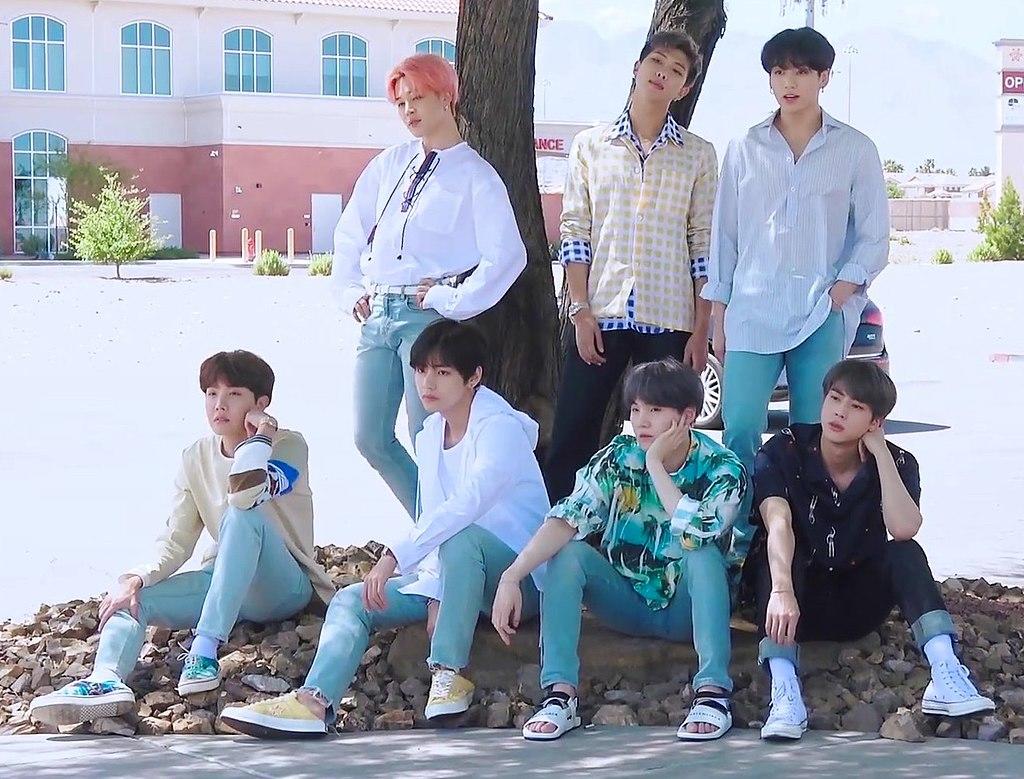 BTS posing for a photoshoot outside