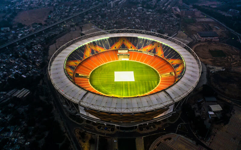 aerial view of floodlit cricket stadium