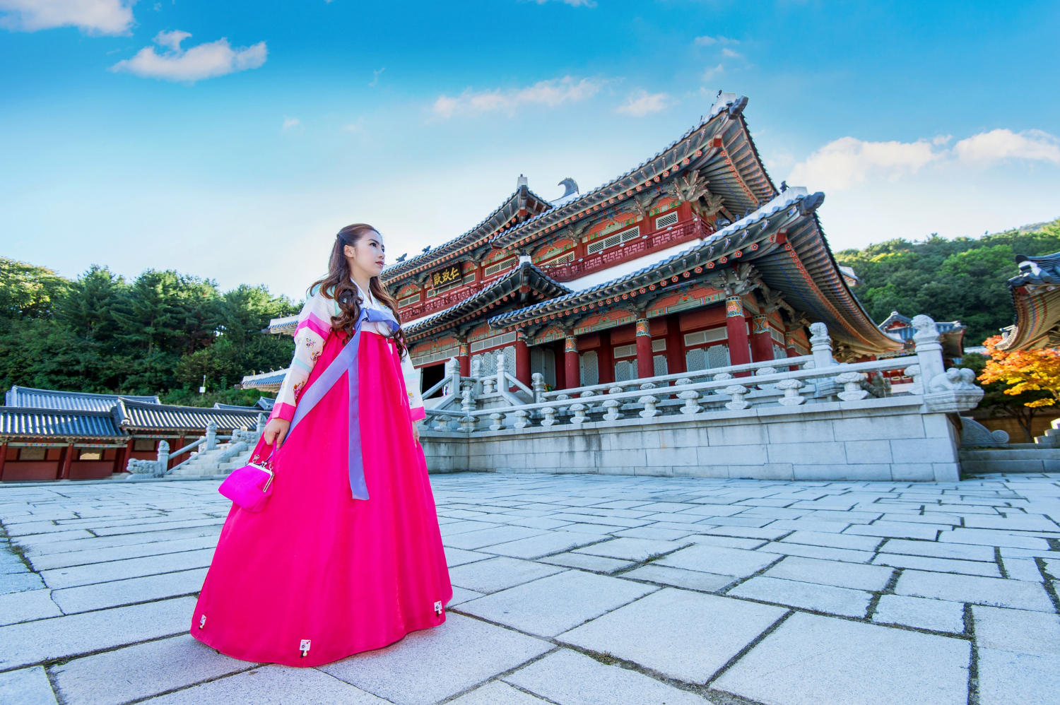a woman wearing Hanbok in Gyeongbokgung, South Korea