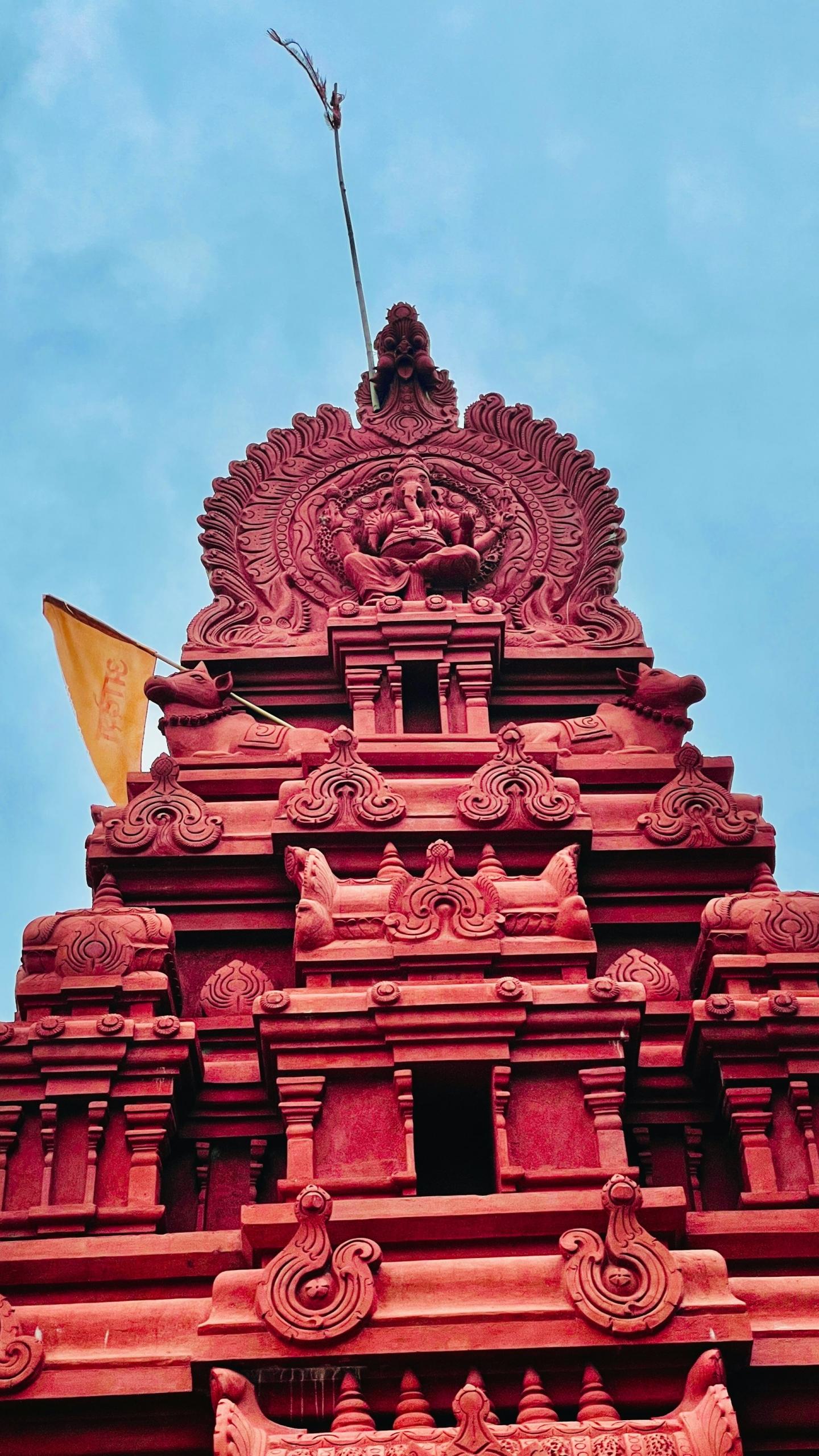 A perspective of God Ganesha Temple, which is red in colour