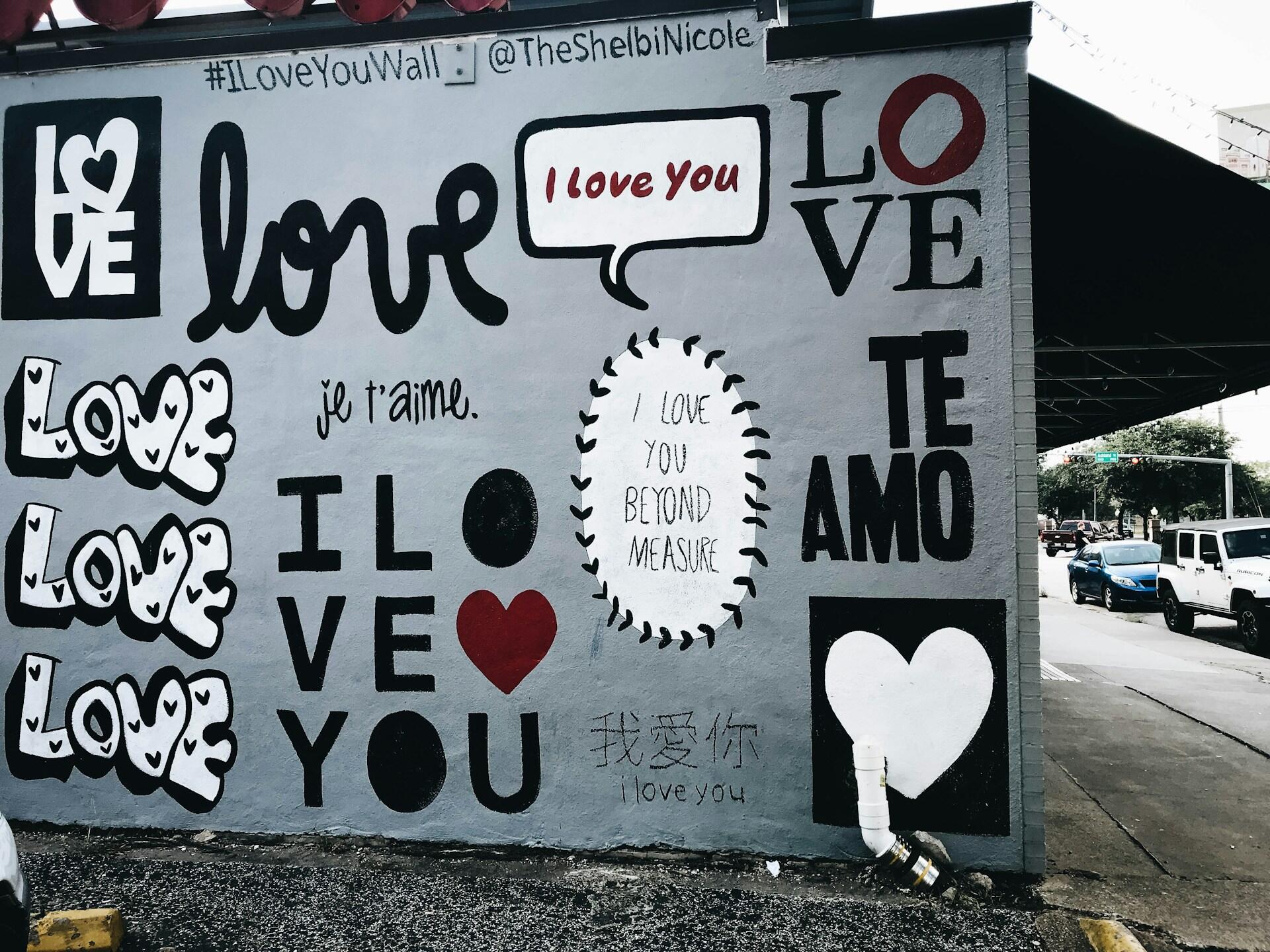 a street mural that says "I love you" and "te amo"