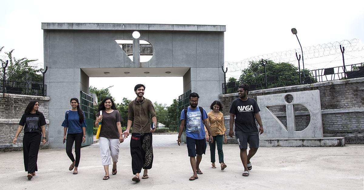 students walking in front of building