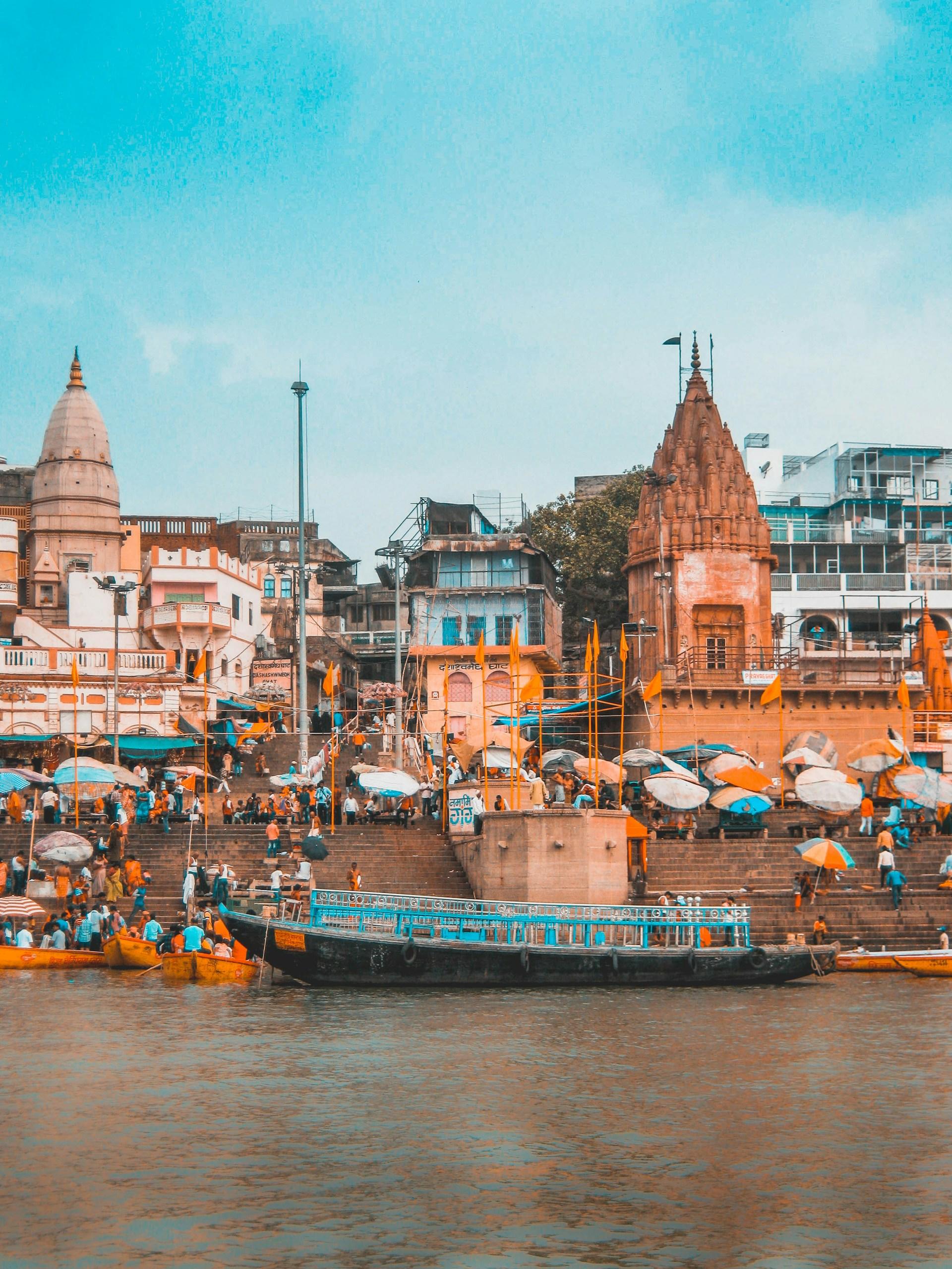 The Ganges River along a ghat with a boat