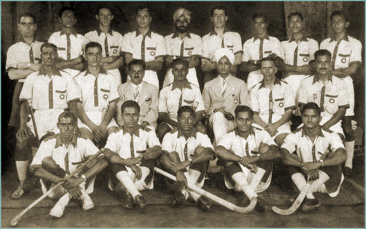 A black and white photo of the 1936 Olympics Indian field hockey team