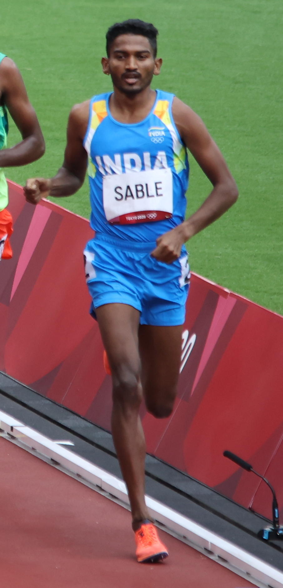 Photo of Avinash Sable running on an Olympics track