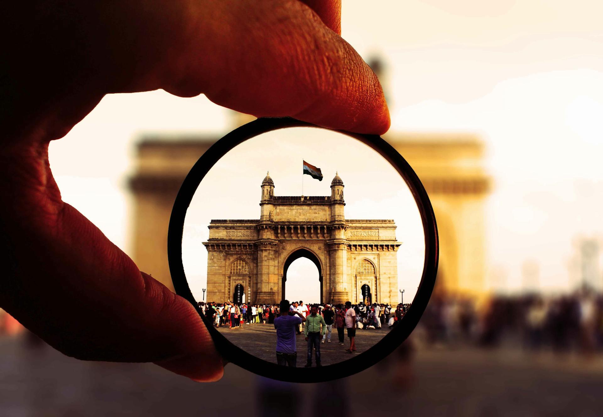 A photo of the Gateway of India monument through a monocle eyeglass