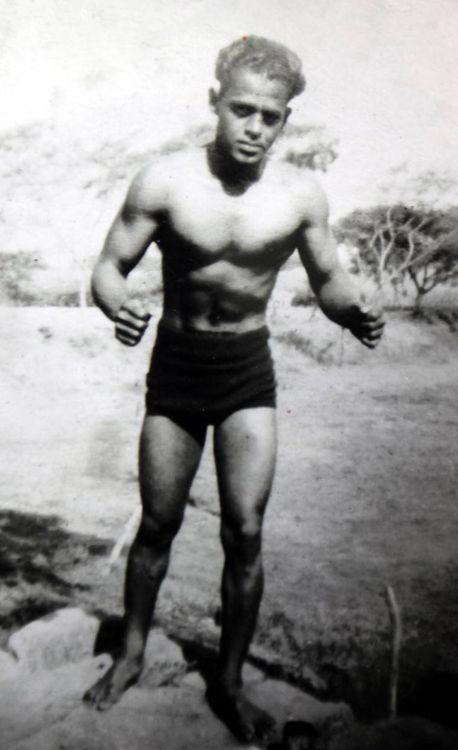 A black and white photo of KD Jadhav as a young athlete