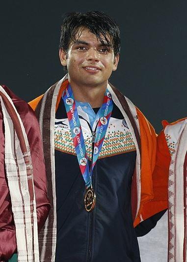 Neraj Chopra wearing a the gold medal at the championship