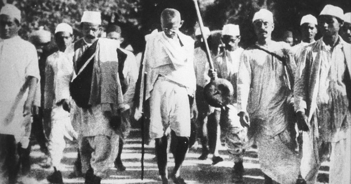 black and white image of Gandhi on a march