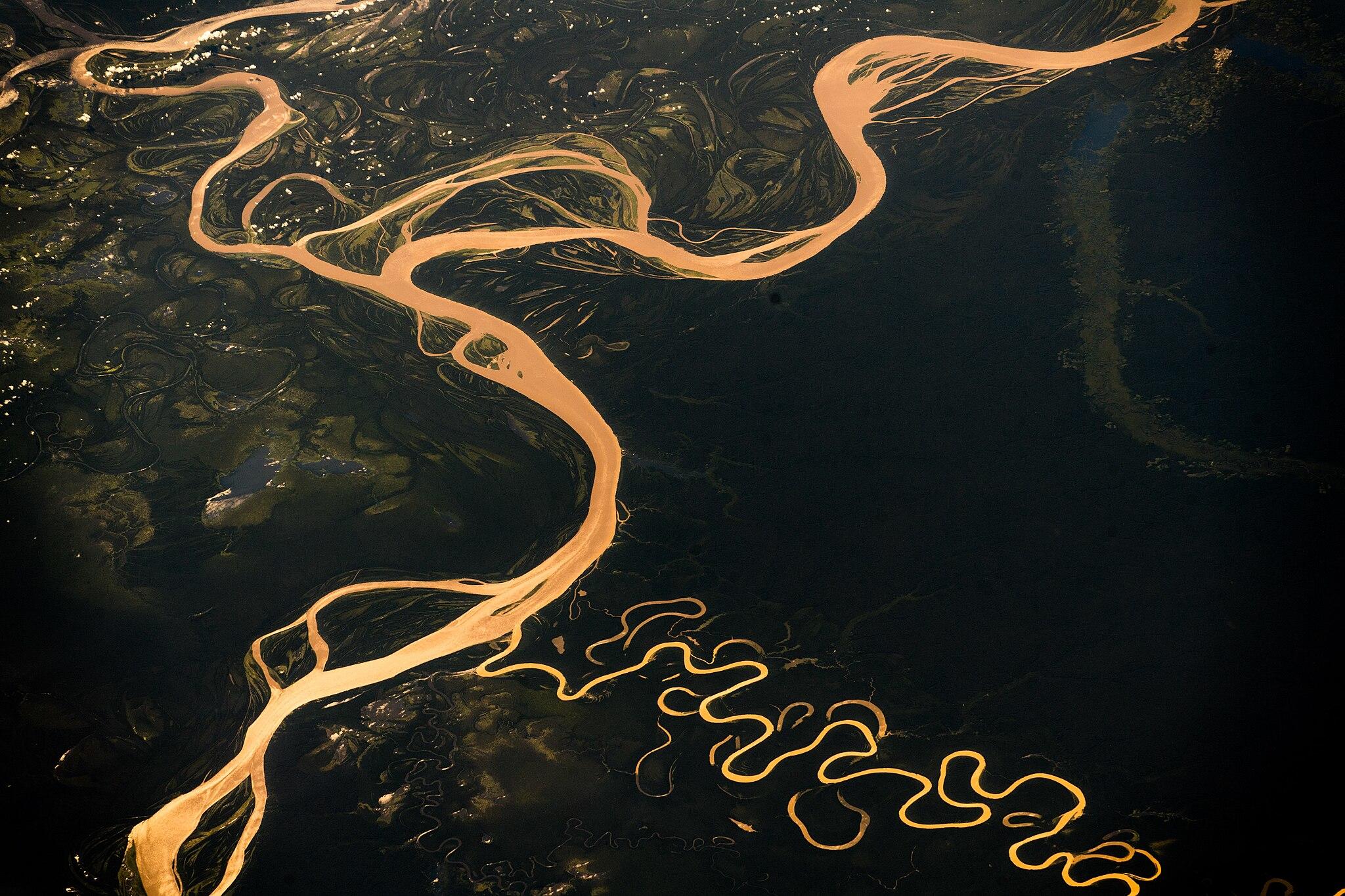 an aerial photo of the Amazon river showing its winding path across the land