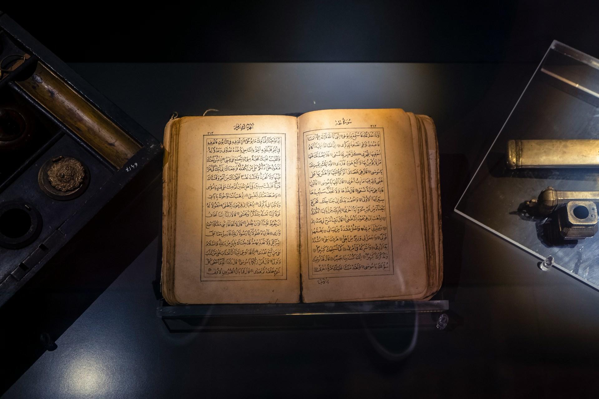 An old book showing an ancient language in a museum