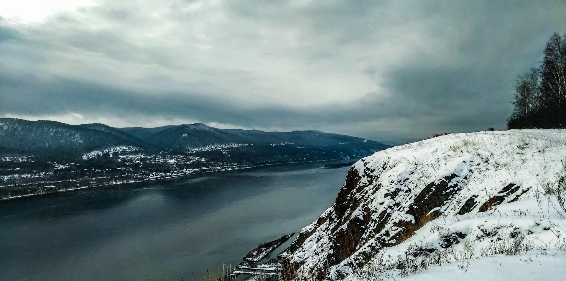 The Yenisey River surrounded by snowy hills
