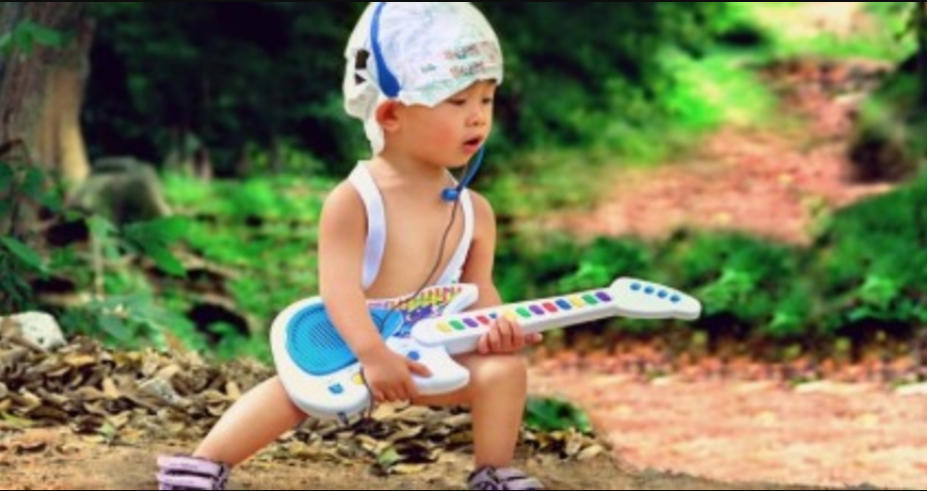 You can learn guitar from any age - like this baby