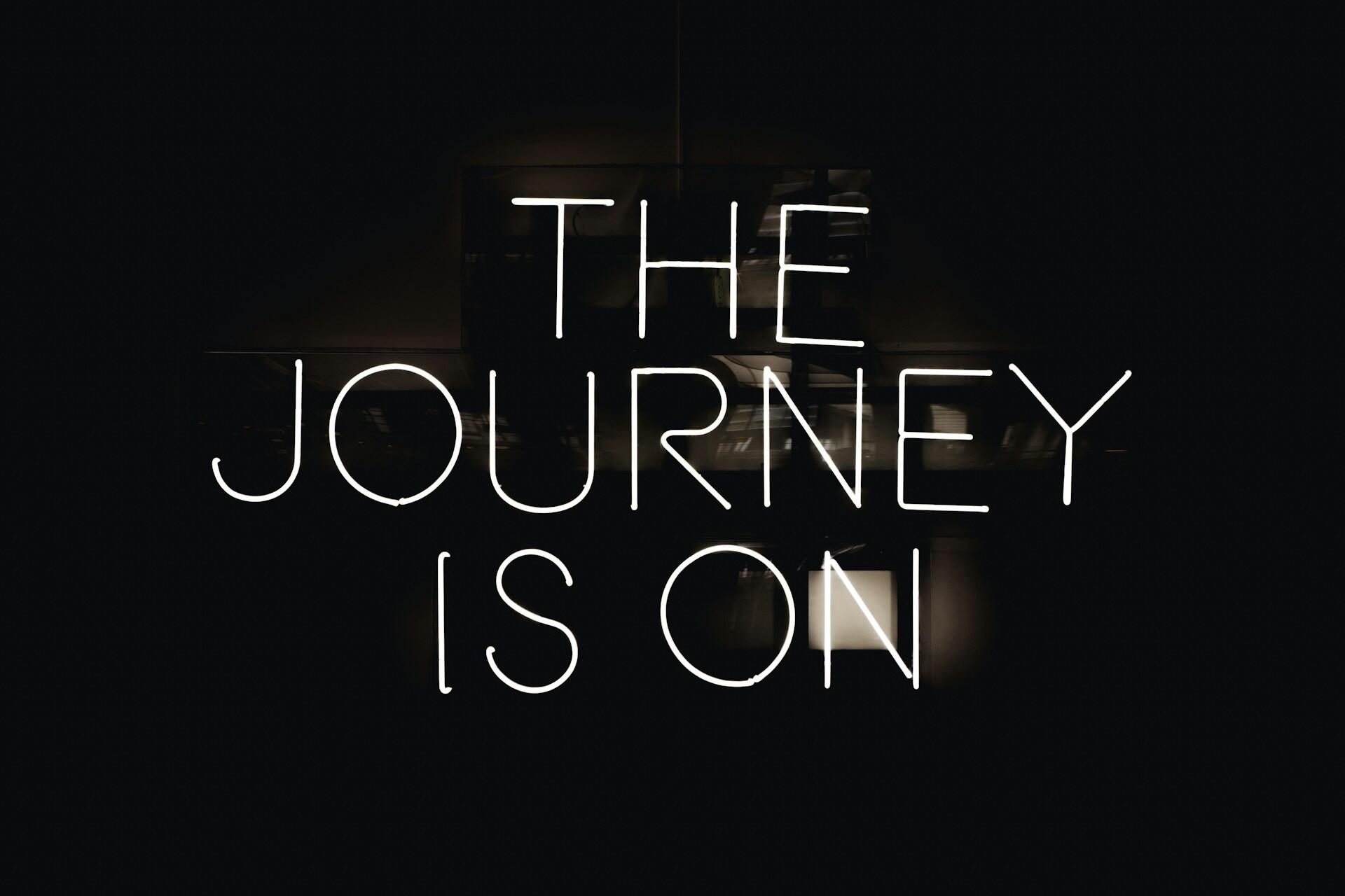 scritta neon the journey is on