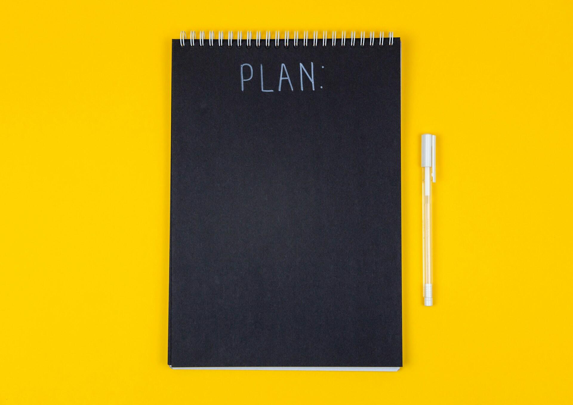 Blocco note con scritto plan