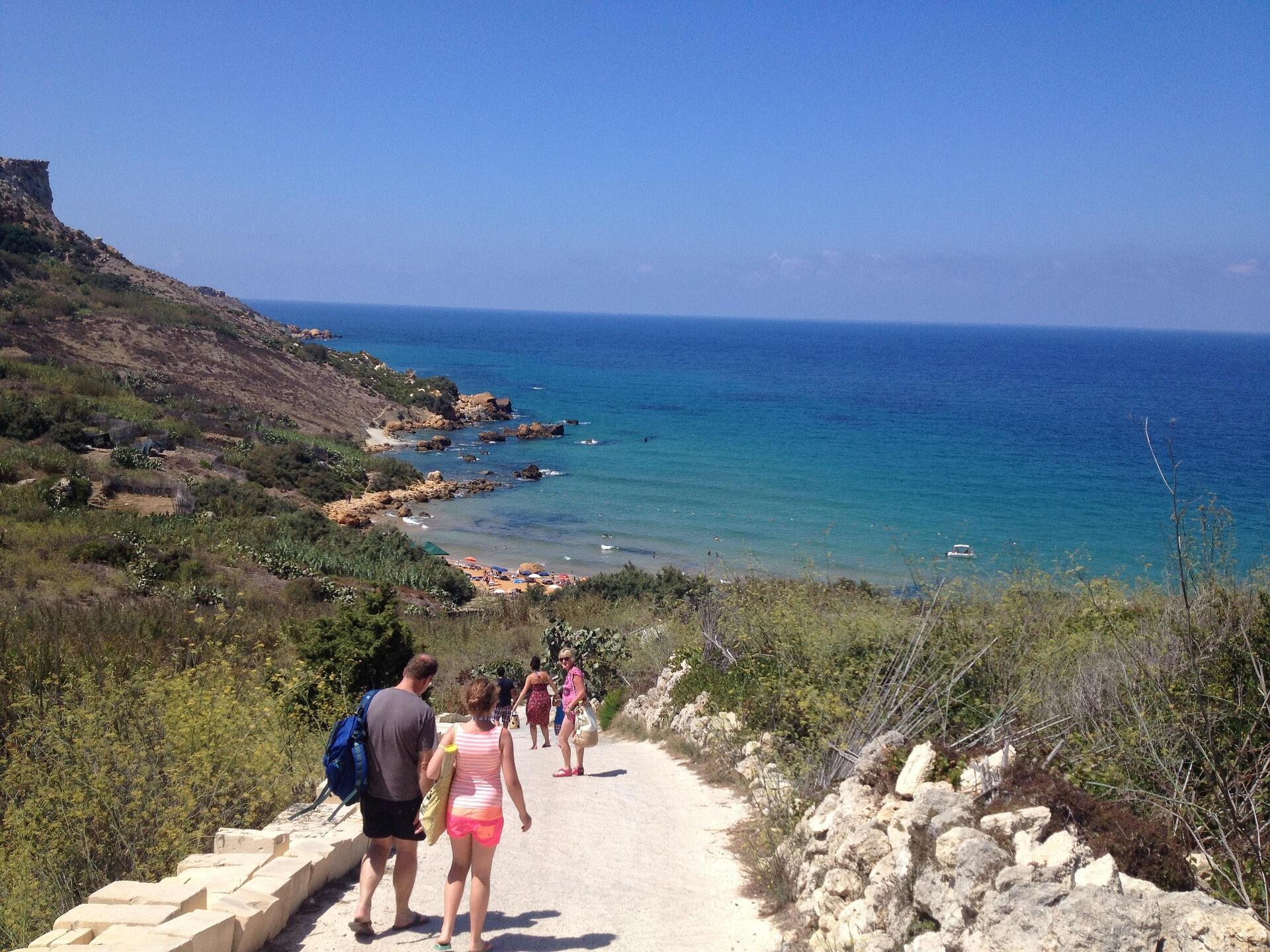 Students walking along a coastal path in Gozo, Malta, enjoying the island’s peaceful atmosphere after English lessons.