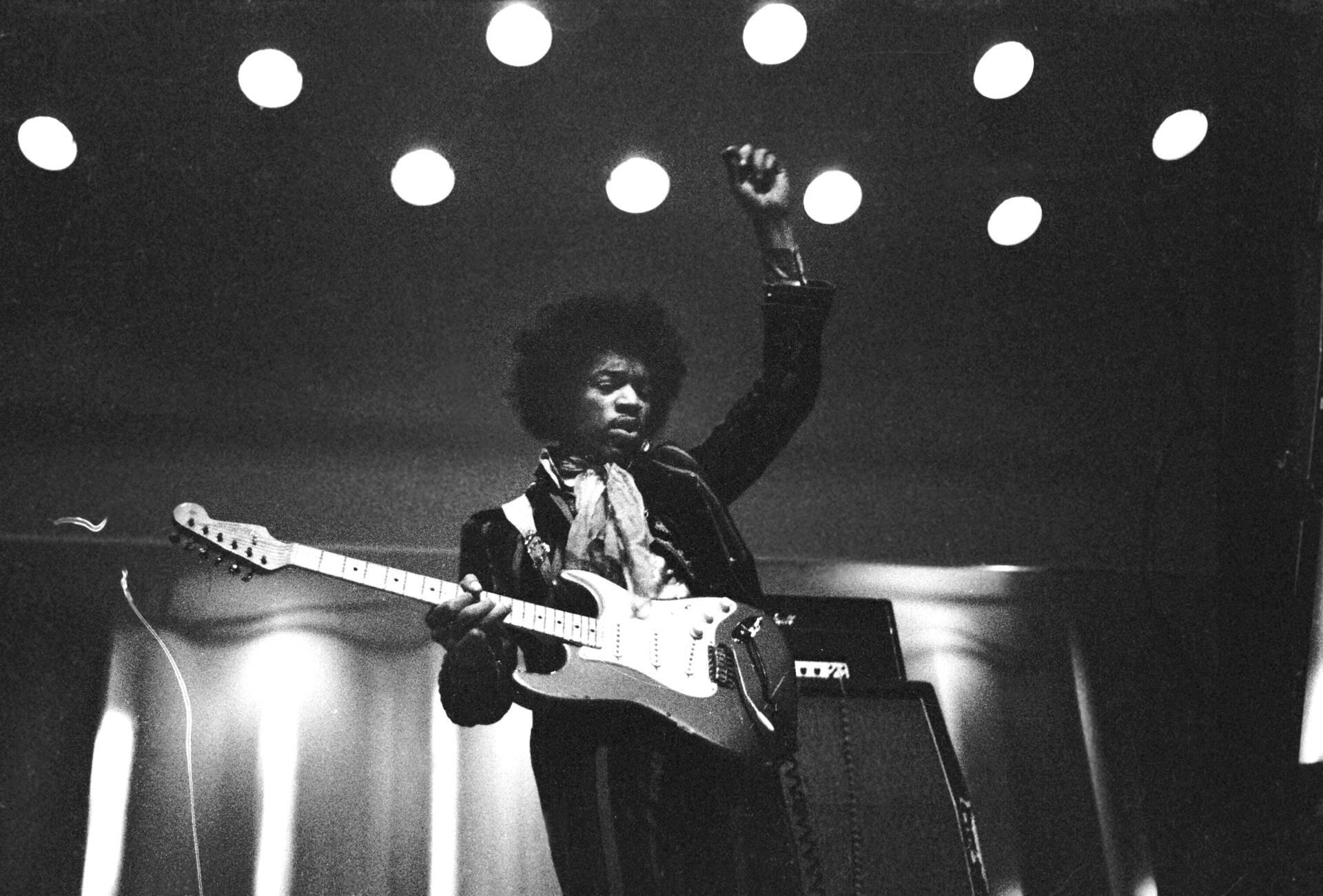 Jimi Hendrix performing live with his guitar during the 1967 Monterey Pop Festival.
