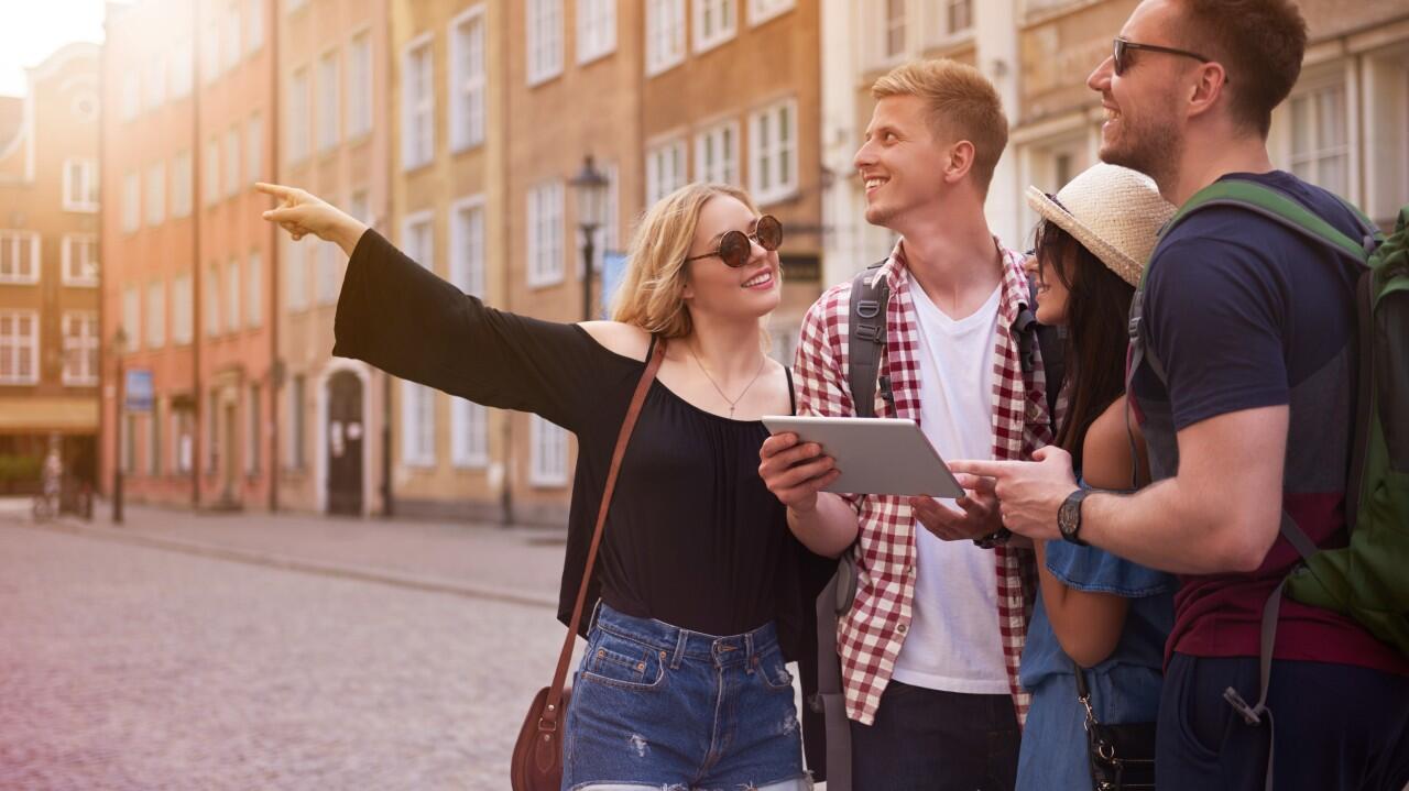students communicating and asking directions while practicing a foreign language