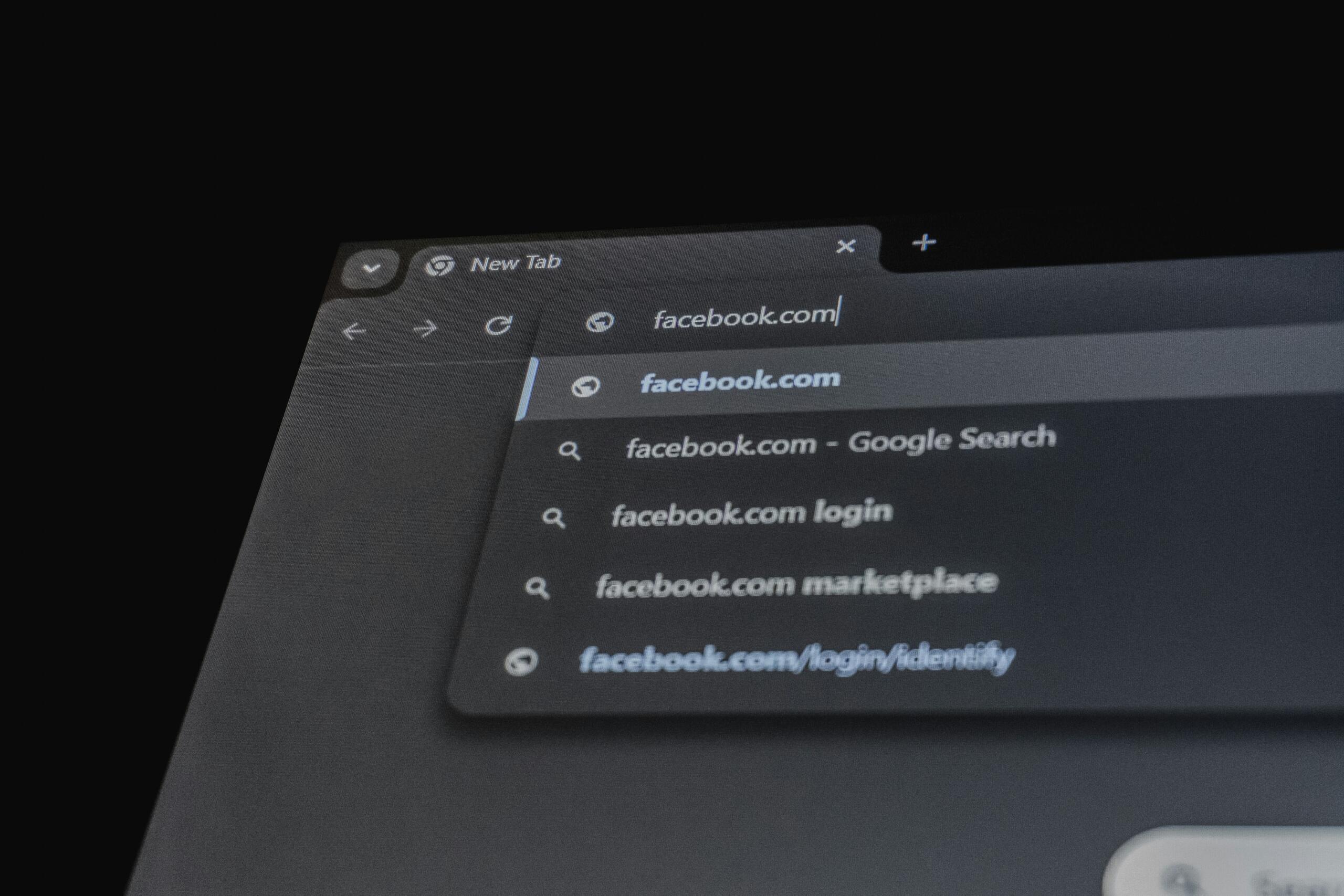 A computer screen shows a browser with facebook.com in the address bar.