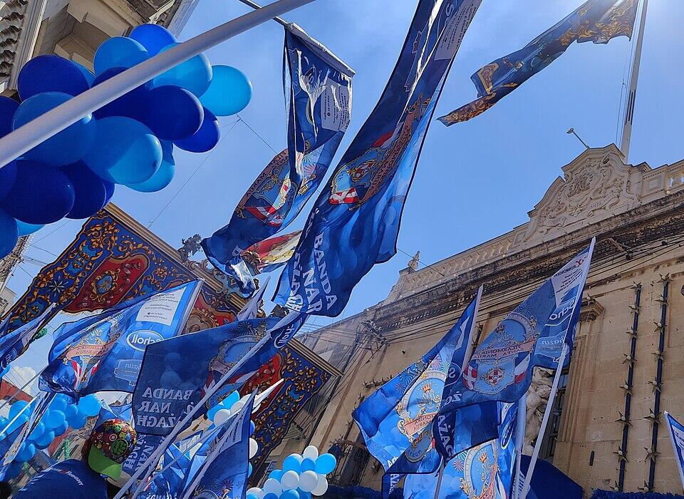band march passing in front of Socjeta Filarmonika Santa Marija in Mosta during the festa of Santa Marija