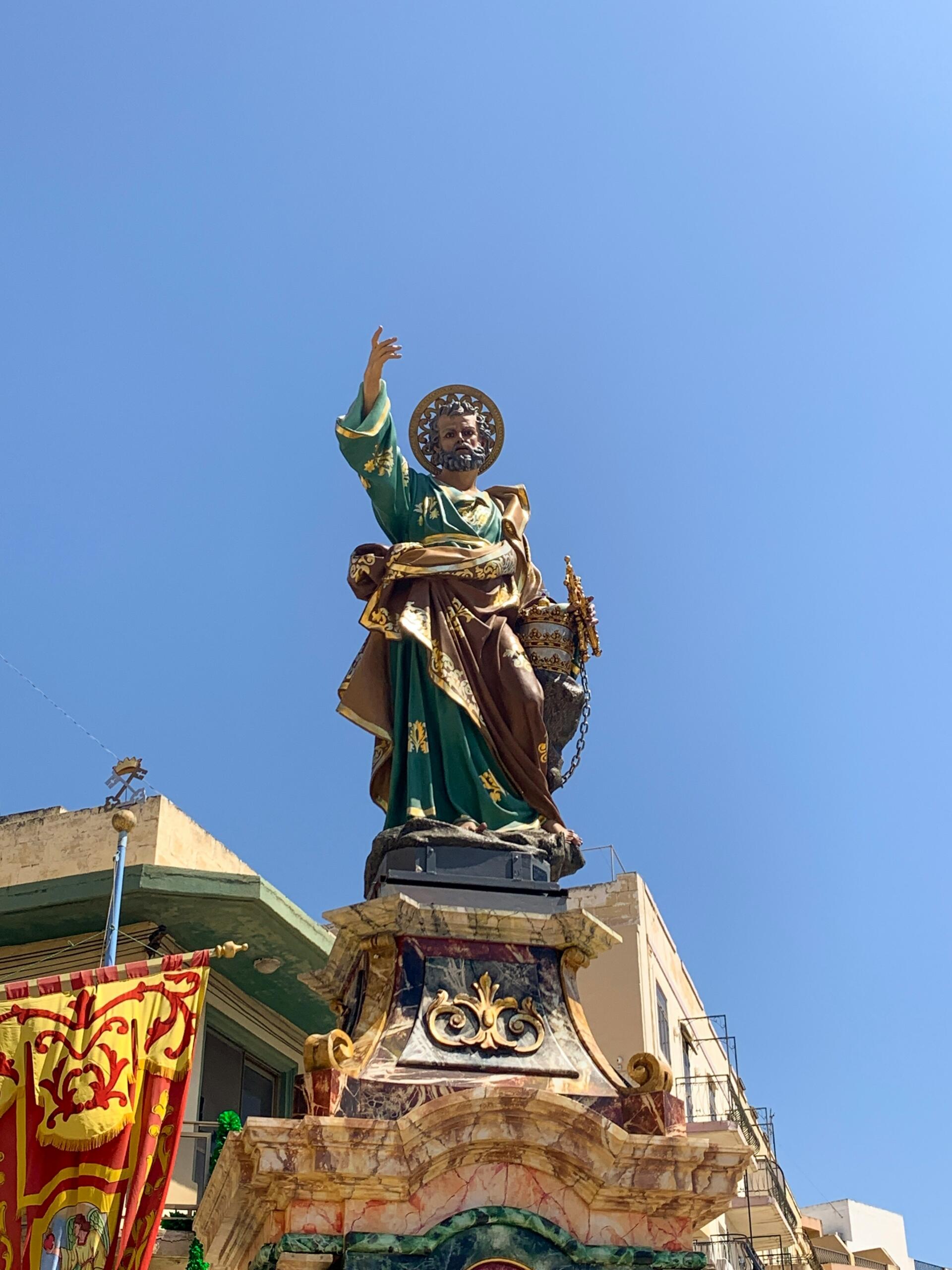 ornate patron saint statue displayed during a Maltese village festa