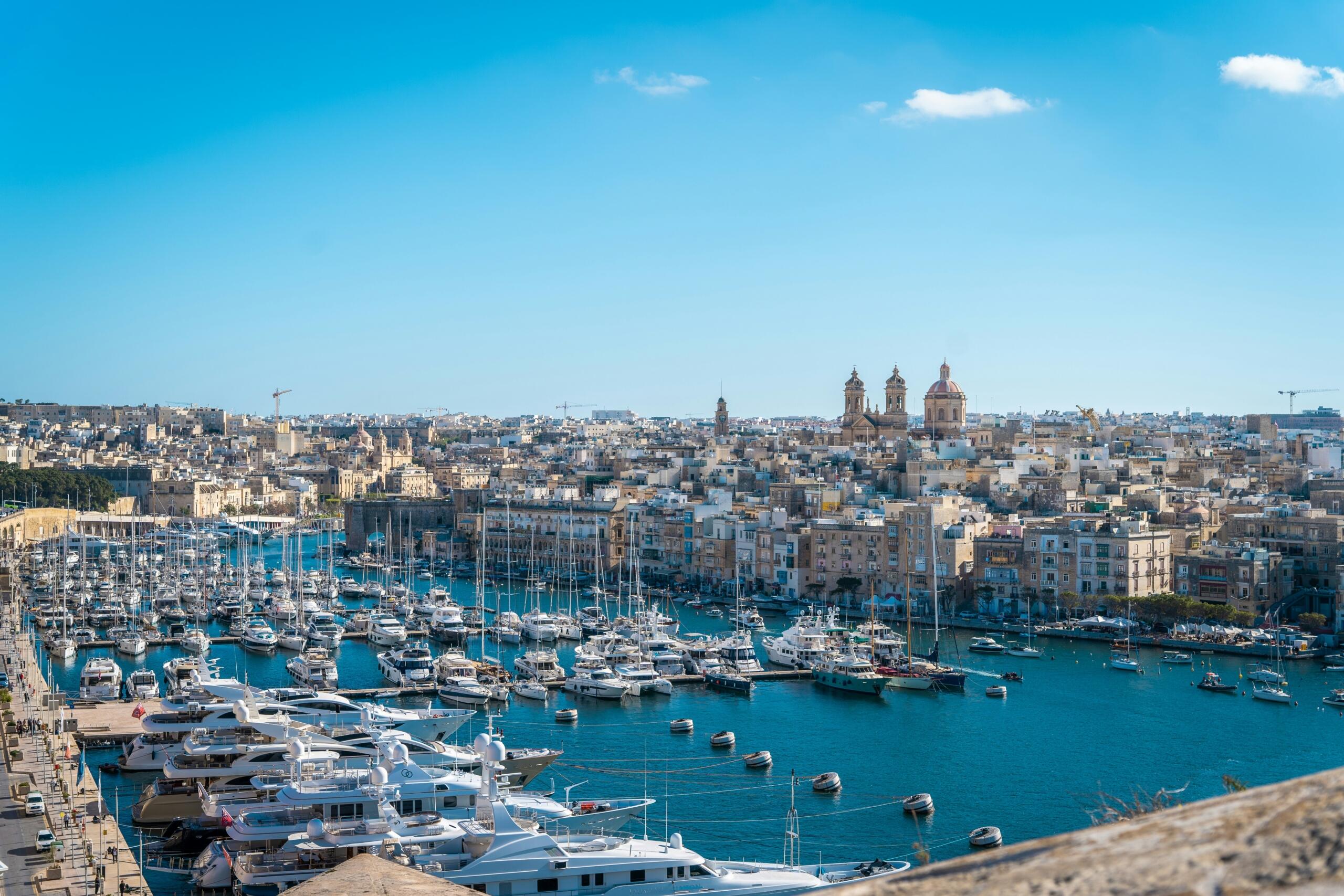 aerial view of the Three Cities waterfront in Malta with historic church domes and marina