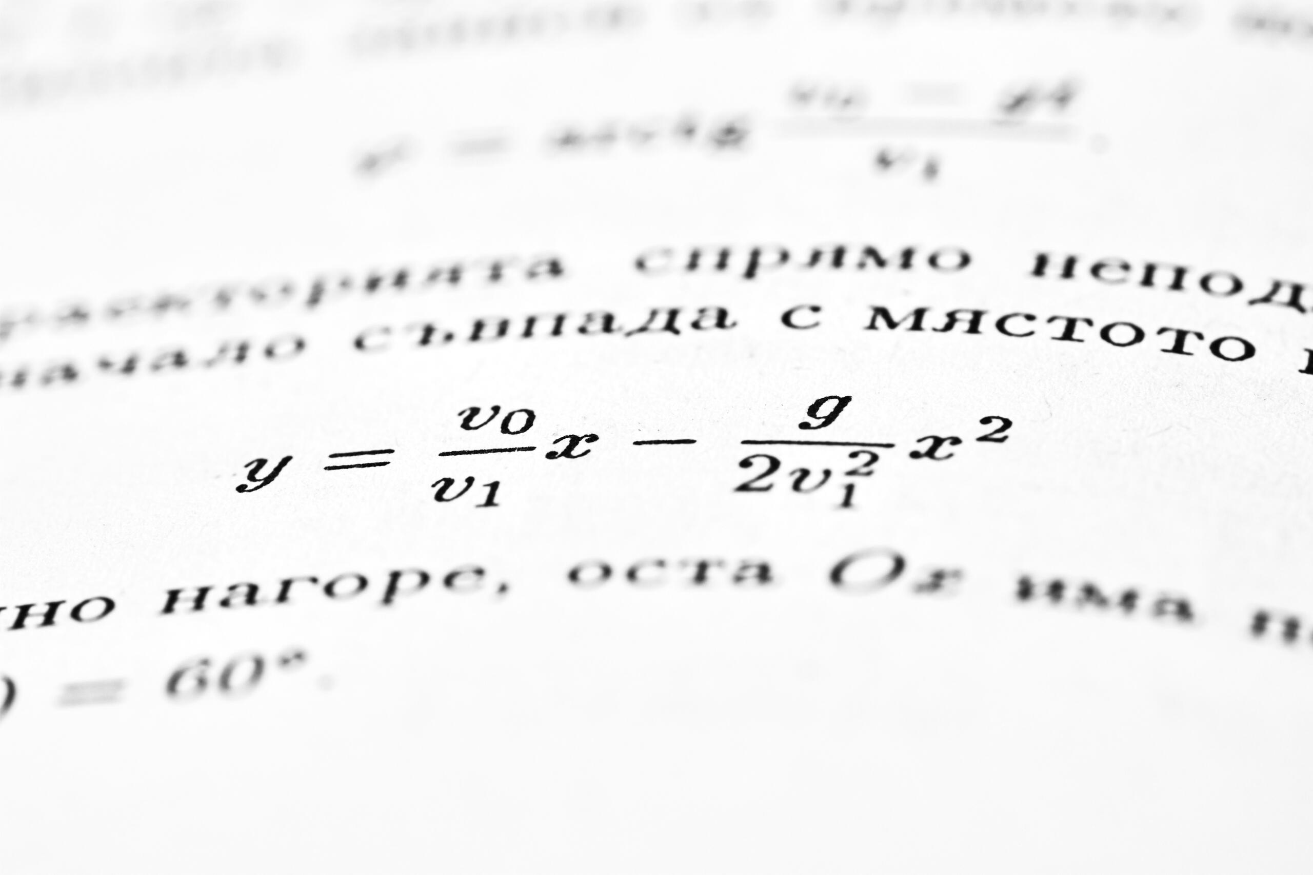 Close-up of mathematical equations printed on a page
