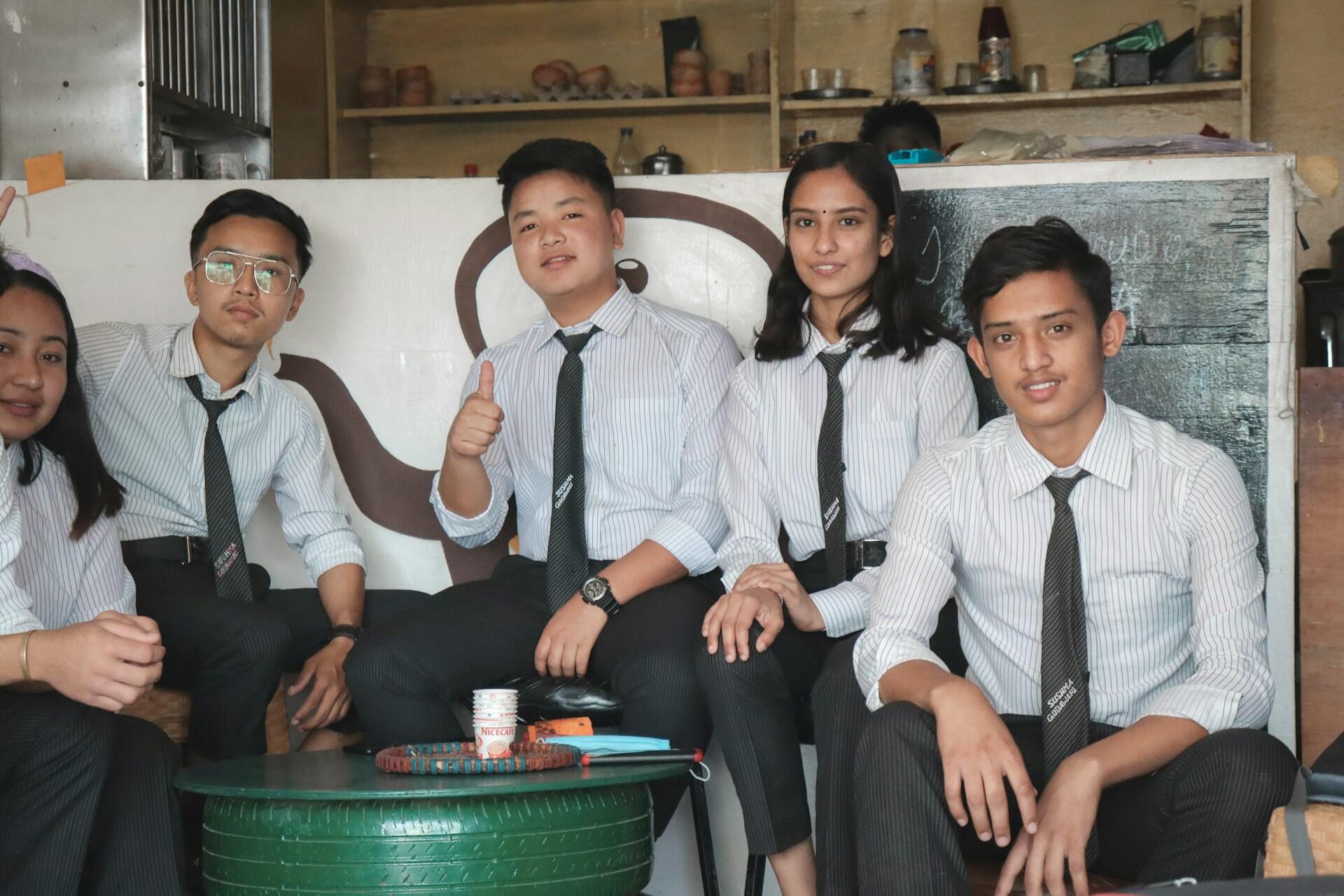 a group of students of different races posing for a photo