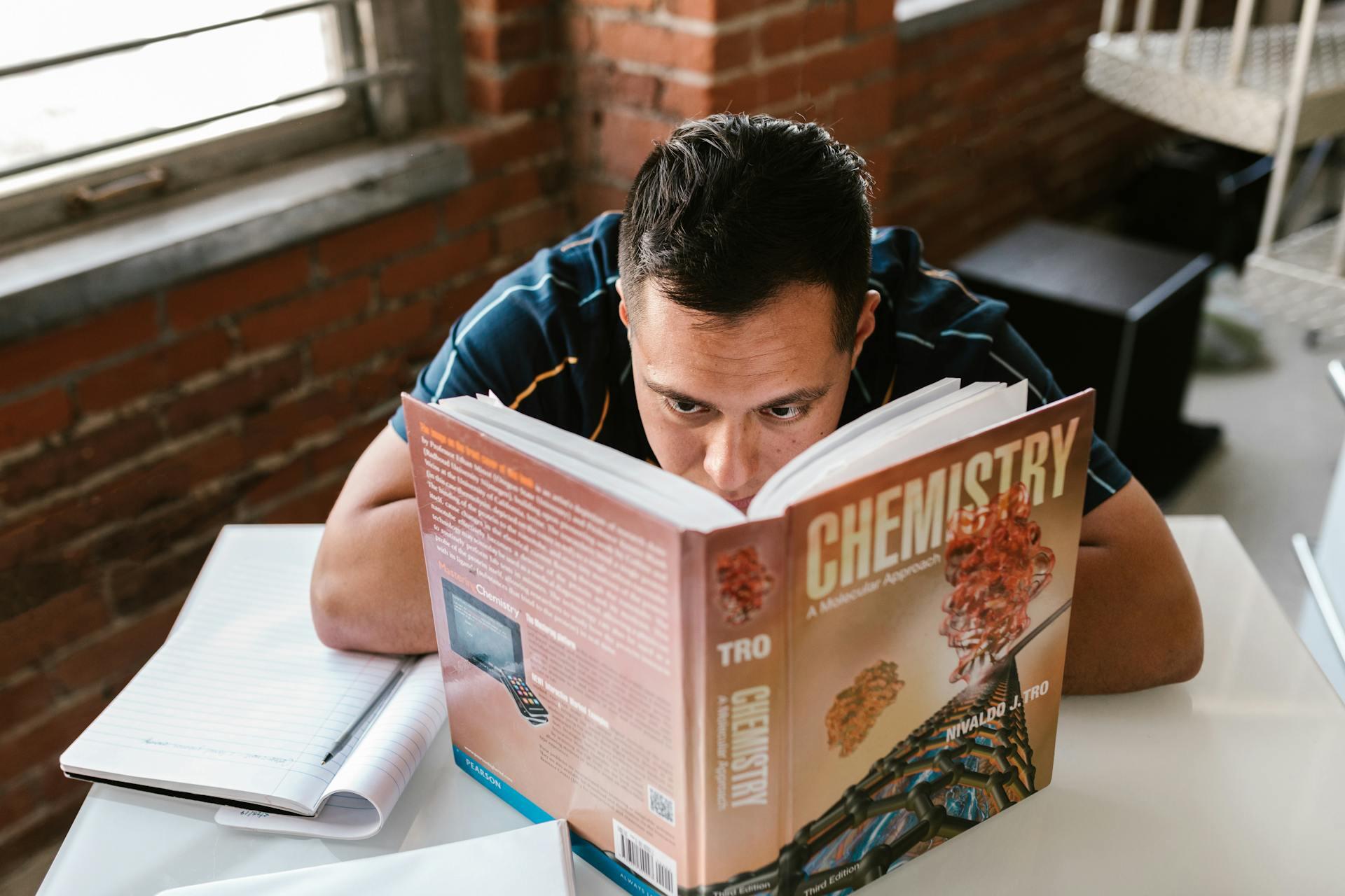 Student staring into a  chemistry book