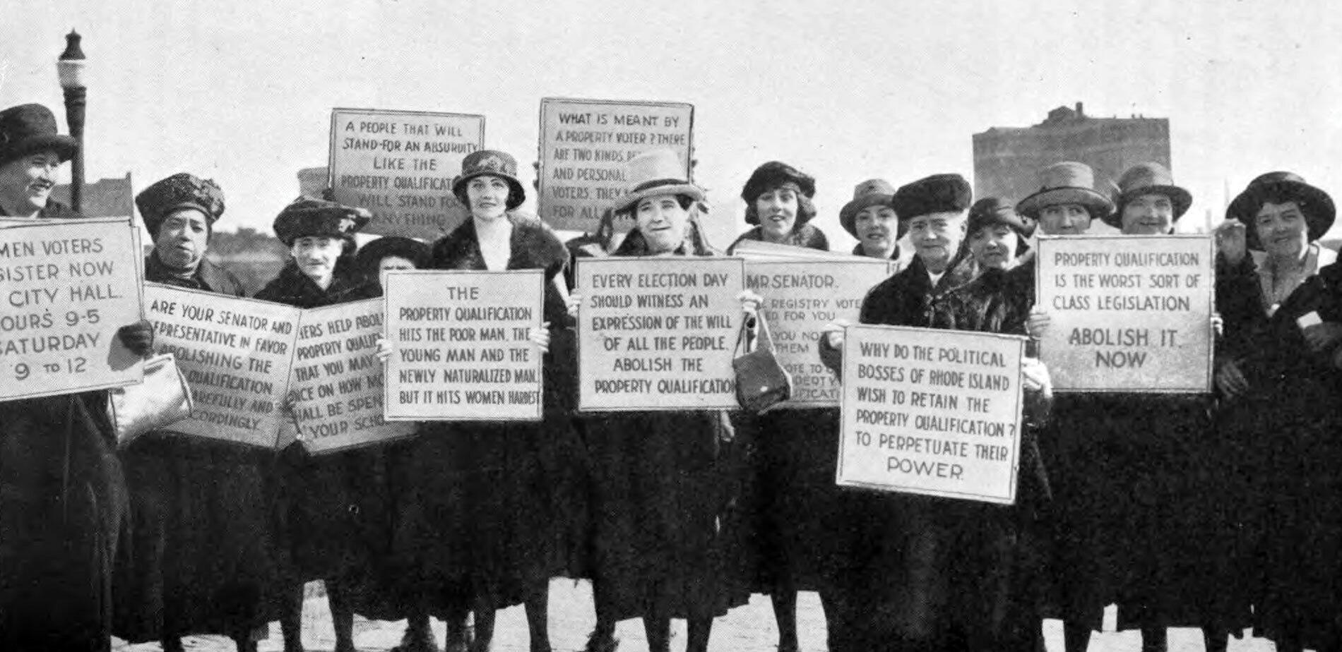 Women holding signs in the Suffrage Movement