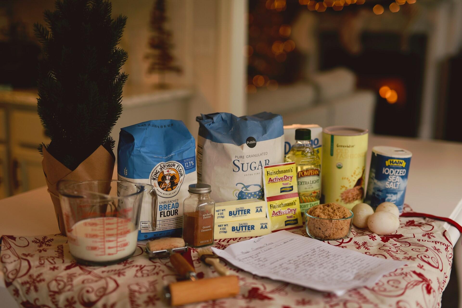 Assorted baking ingredients lined up on a table. 