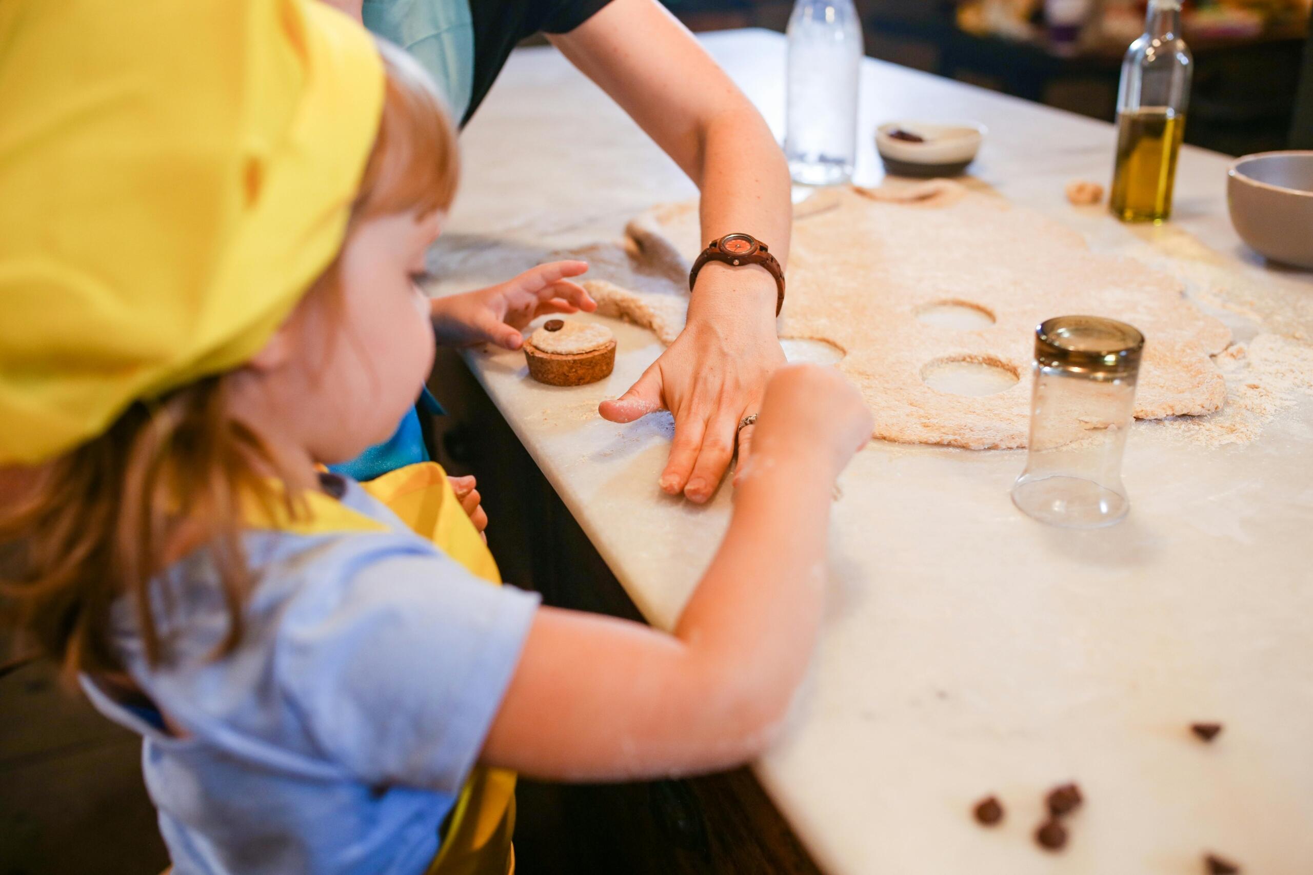 Girl cutting out dough shapes