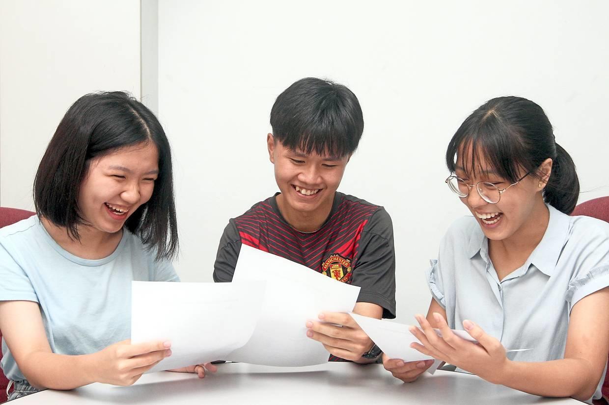 teens smiling at their exam results