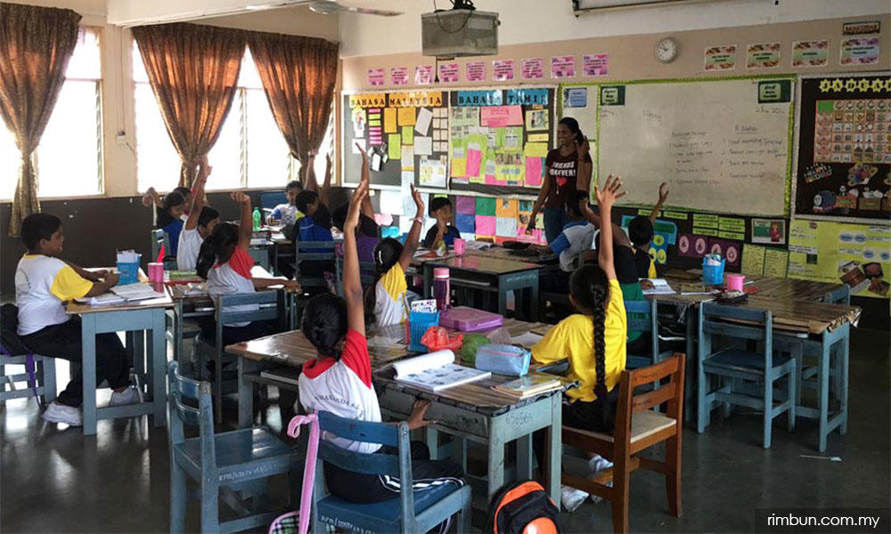 student raising hand