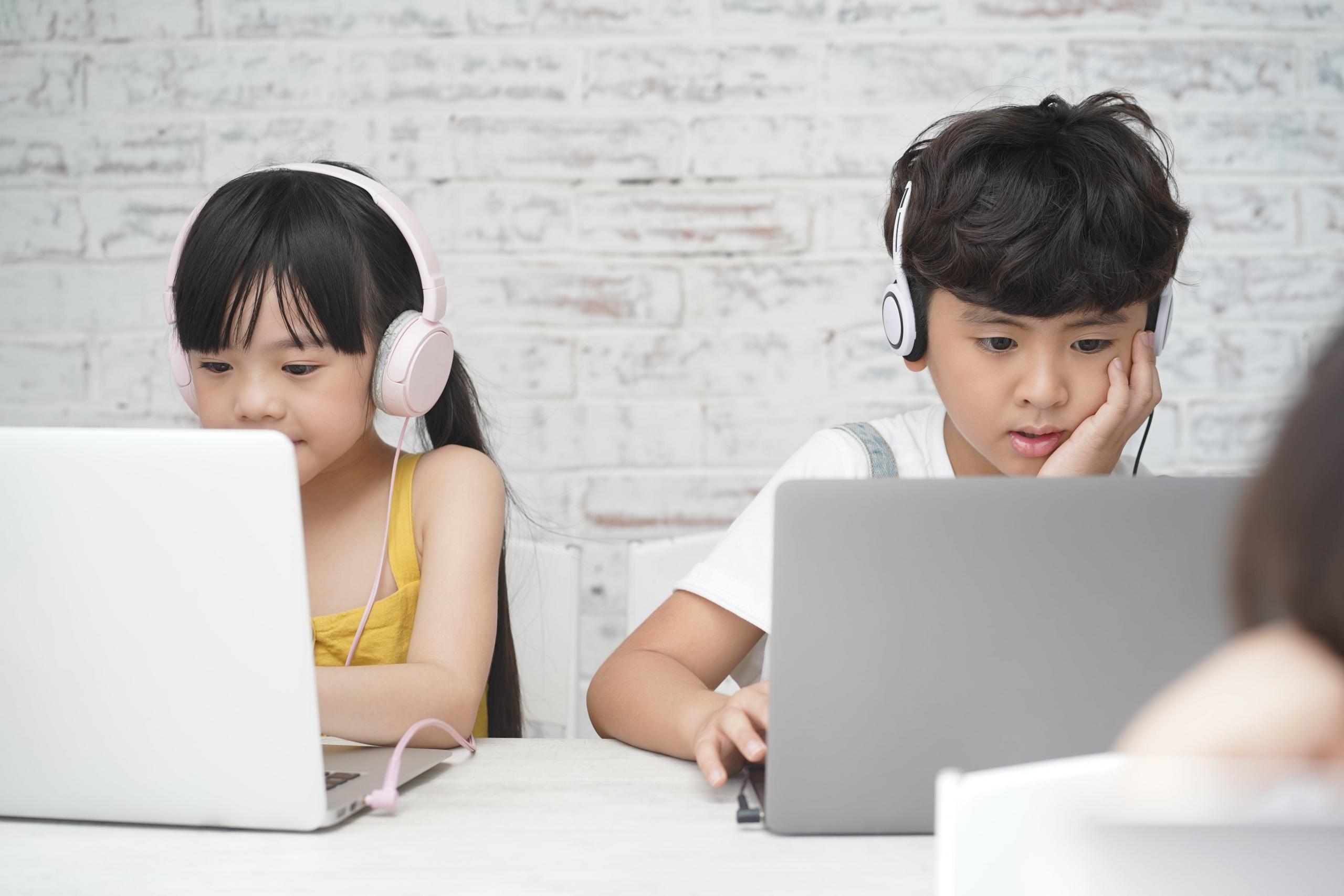 a boy and a girl studying English