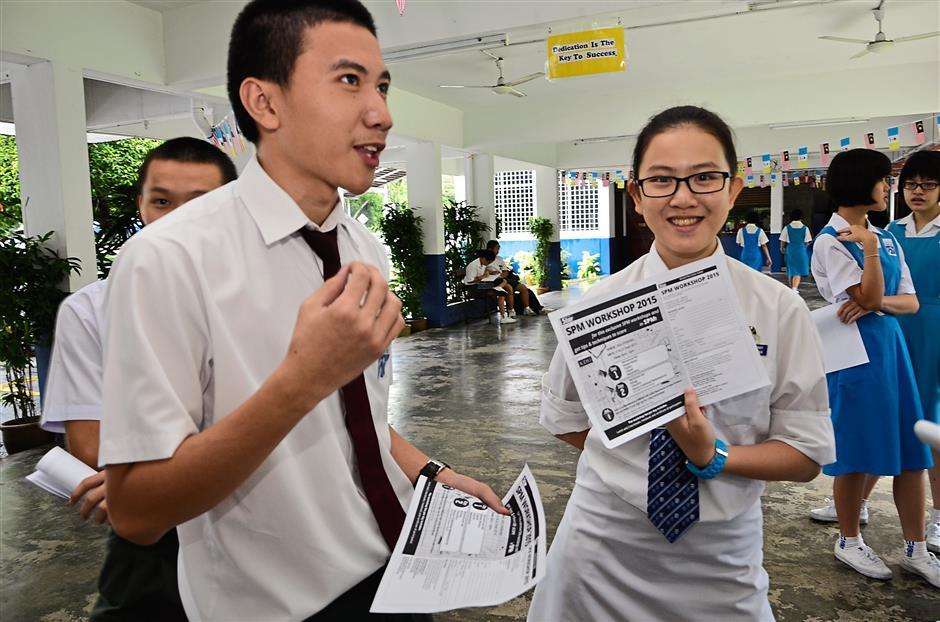 Student showing the exam paper